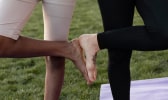 Two women practicing yoga together