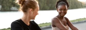 two sporty women working out together