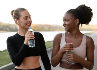 two sporty women taking break